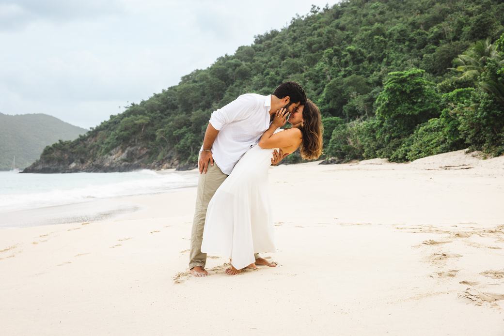 Couple sharing a kiss on the beach