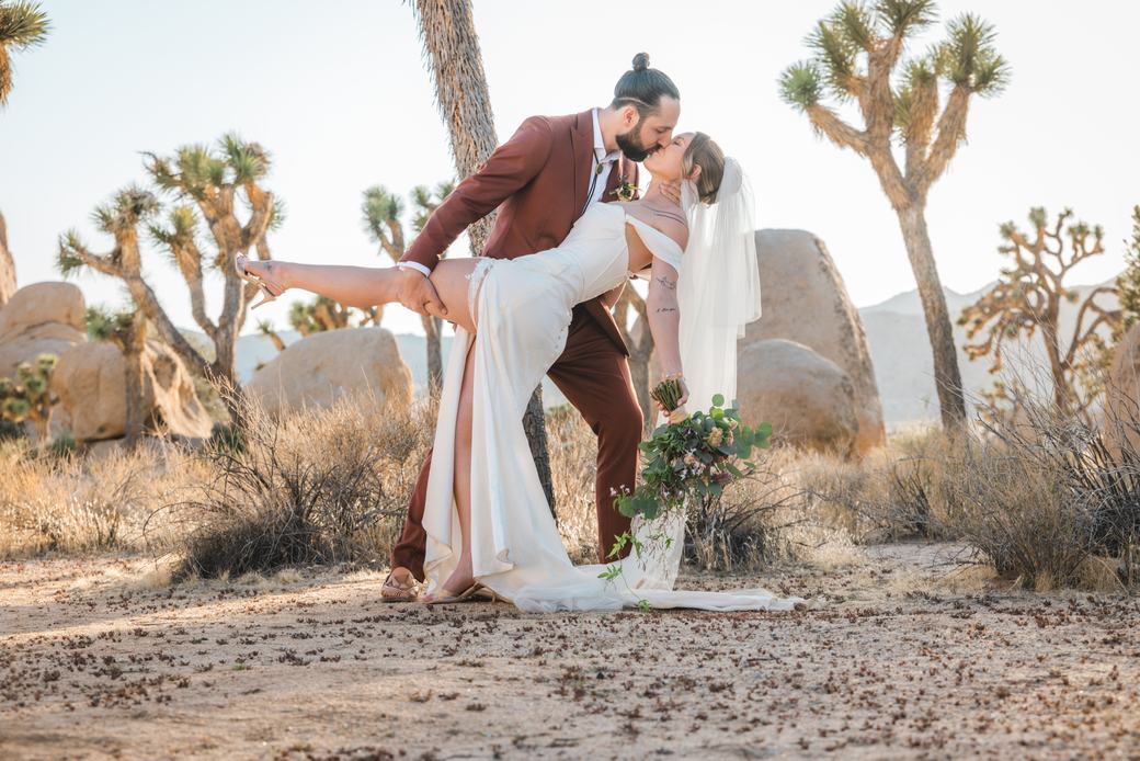 Groom dipping his bride for a kiss